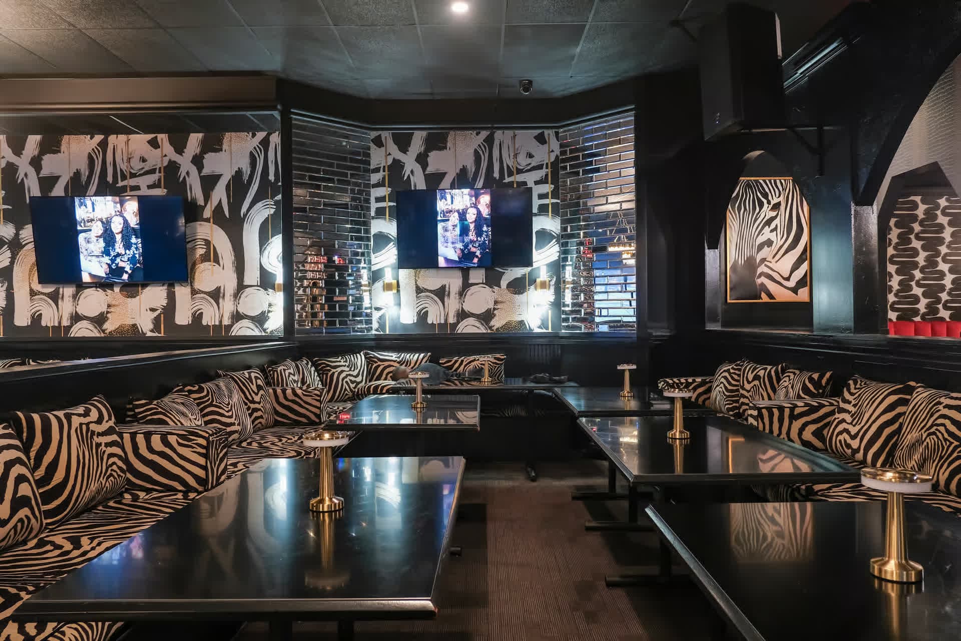 VIP zebra-print booth seating at Pizookah Lounge