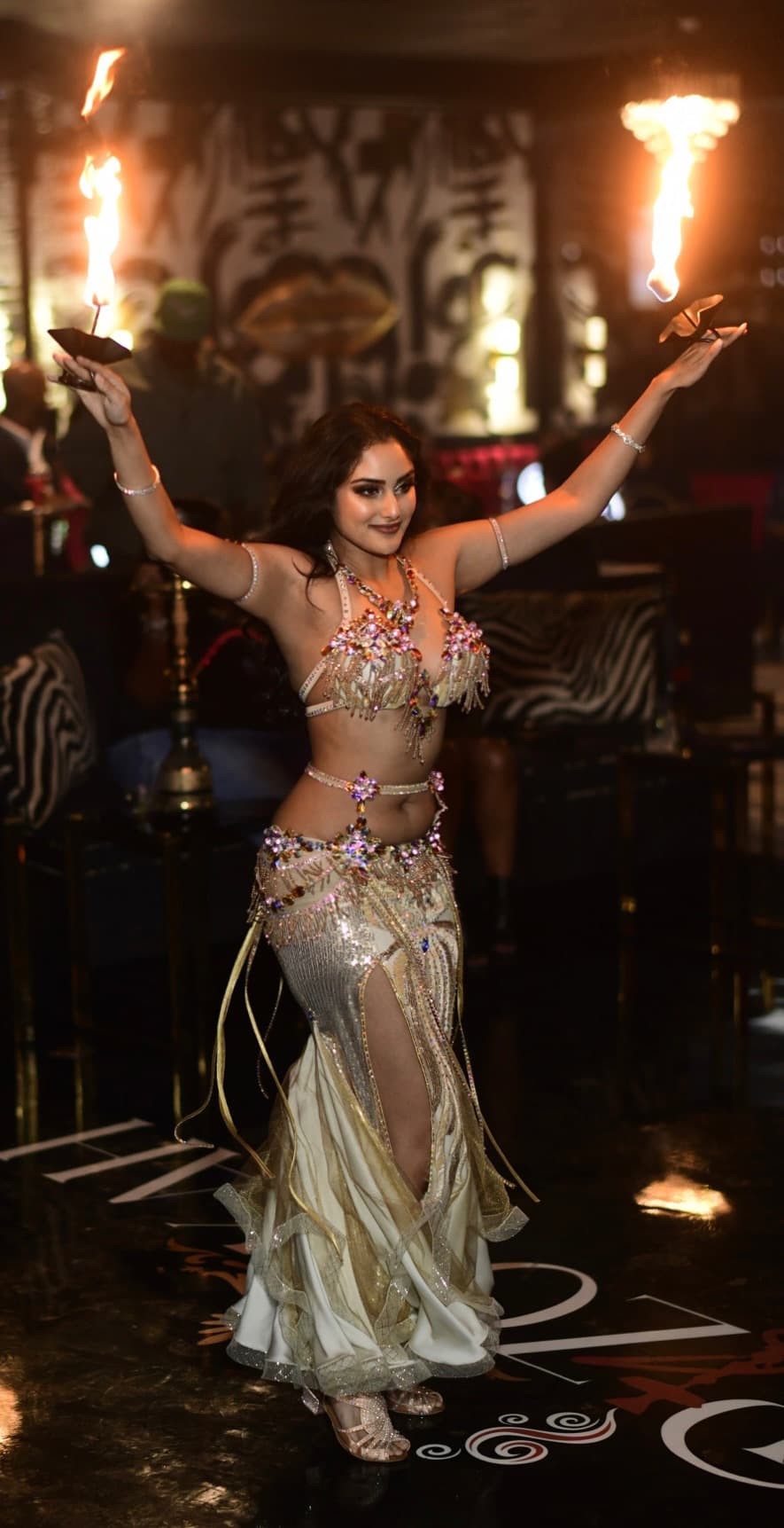 Belly dancer with fire torches